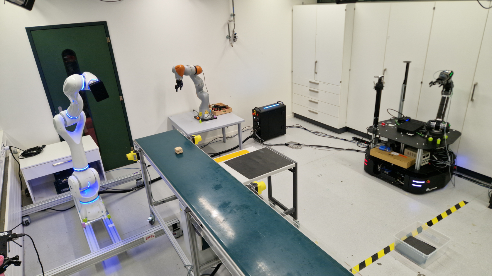 Three different robot platforms in the LASA assembly-line experiment.